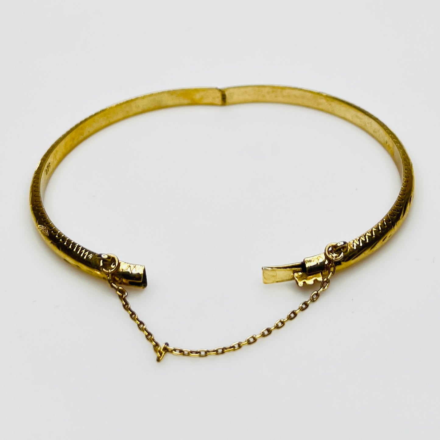 Gold vermeil etched bangle bracelet with floral design, open