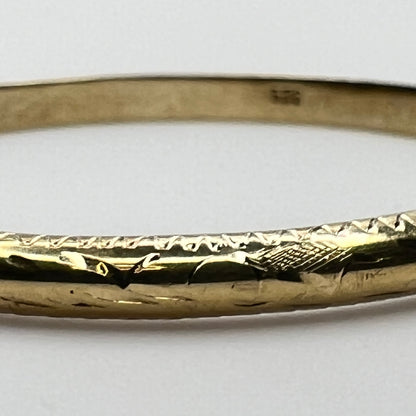 Close-up of etched motif on vermeil bangle