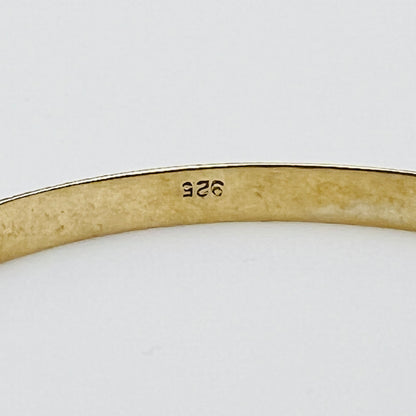 Inside view showing “925” stamp on gold-tone sterling bracelet