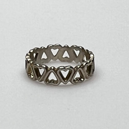 Close-up of silver open-heart design ring with 5mm band