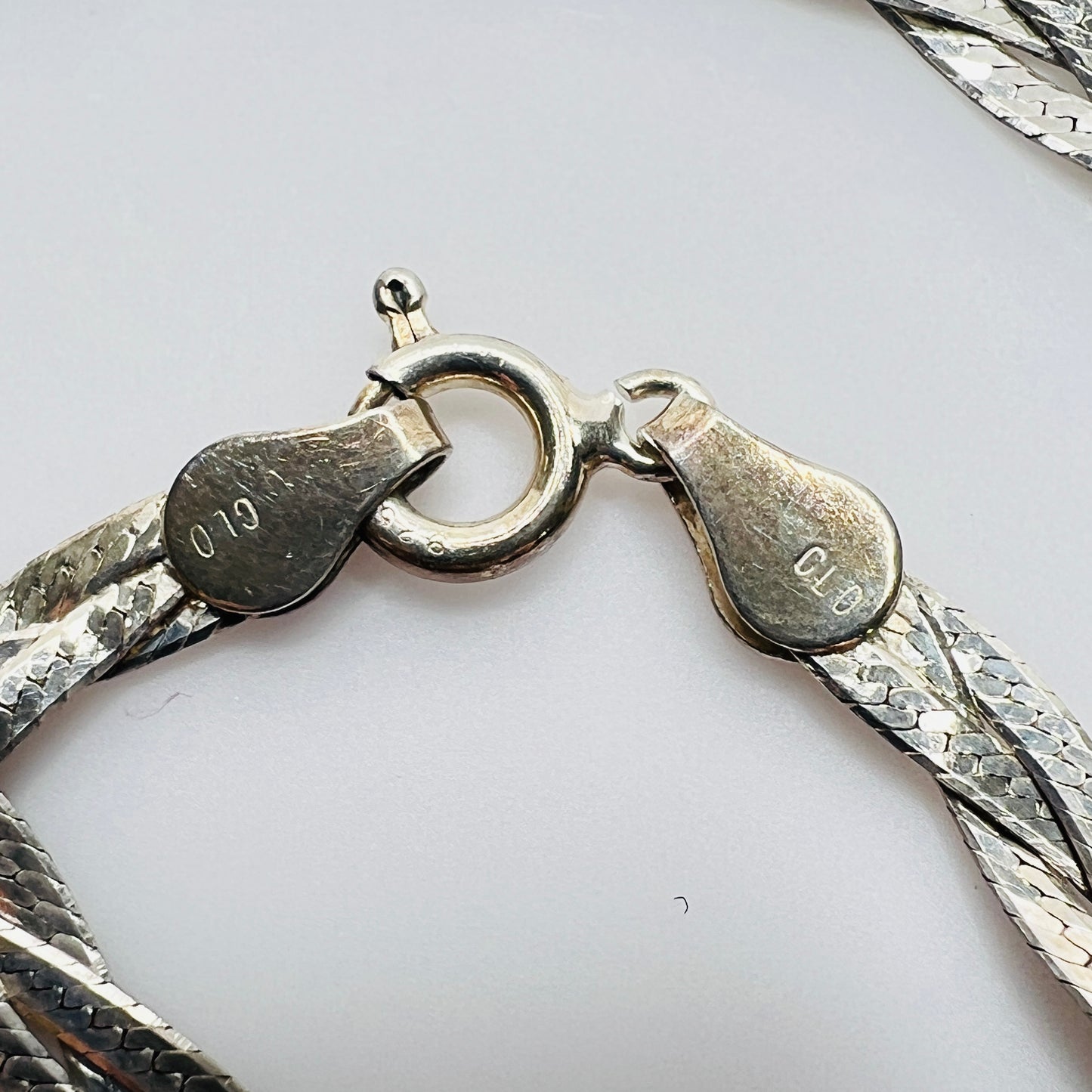 Close-up of clasp stamped Italy 925 and CLO maker’s mark
