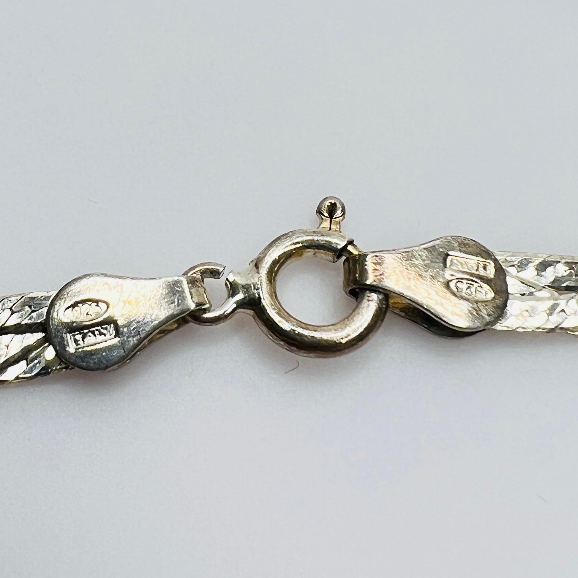 Close-up of clasp stamped Italy 925 and CLO maker’s mark