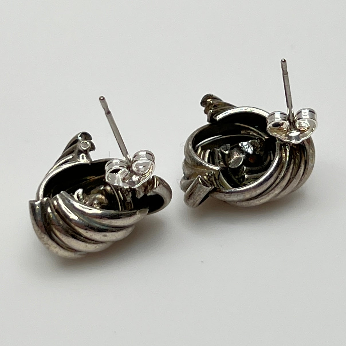 Sterling silver love knot stud earrings with clear rhinestone center, vintage style