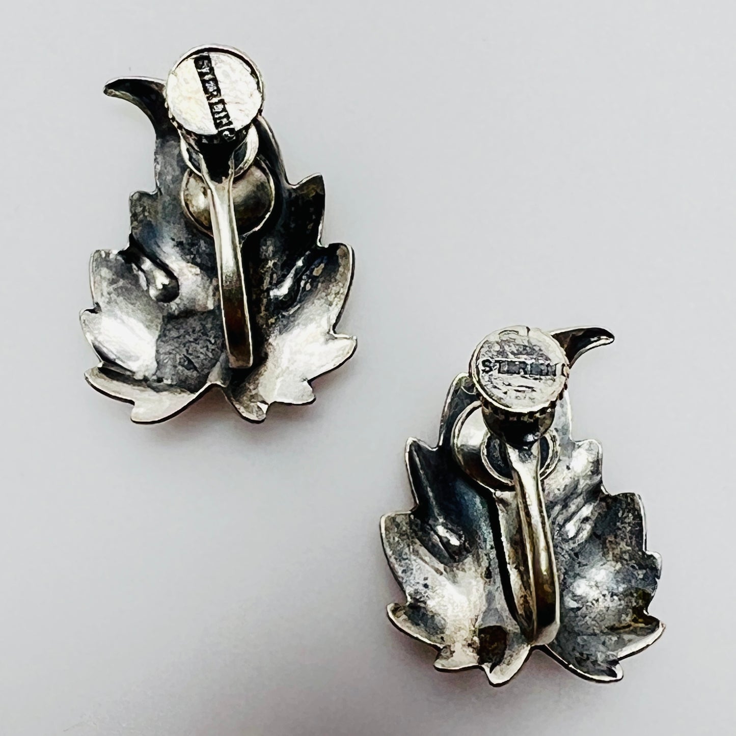 Close-up of sterling stamp on back of earring screw
