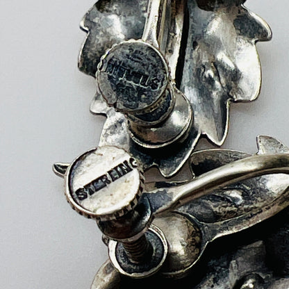 Close-up of sterling stamp on back of earring screw