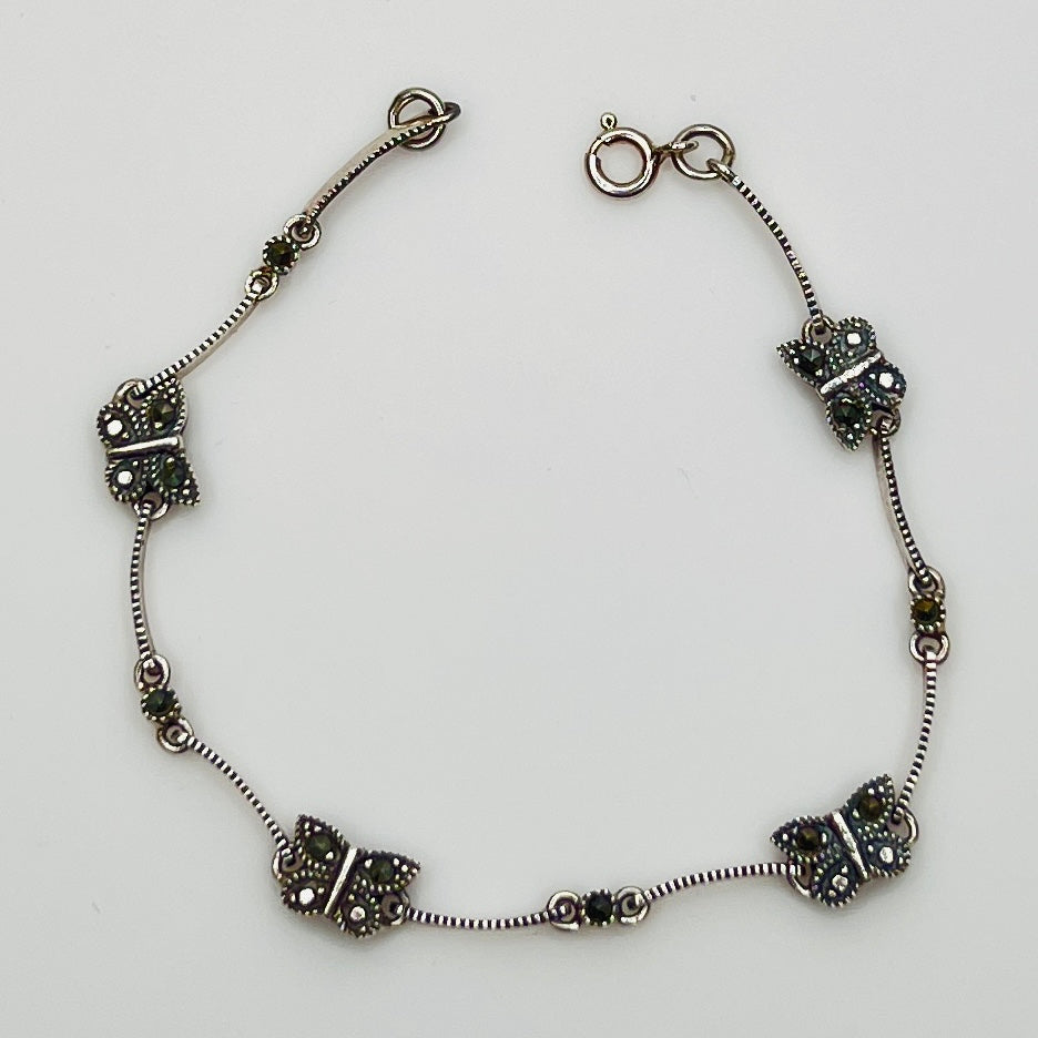 Overhead view of butterfly bracelet laid flat showing clasp and detail