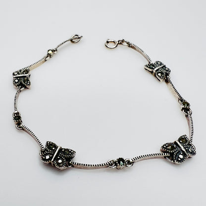 Overhead view of butterfly bracelet laid flat showing clasp and detail