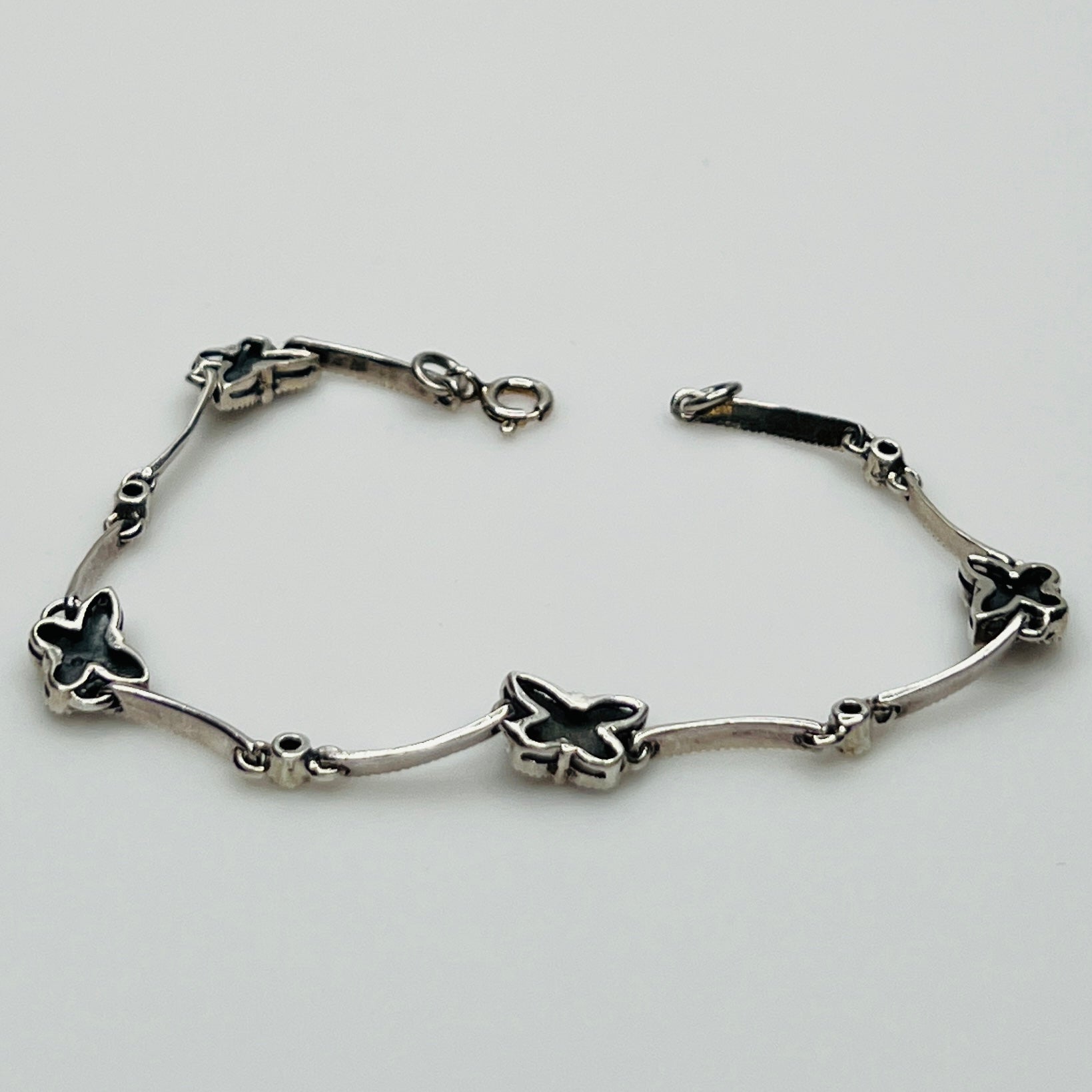 Overhead view of butterfly bracelet laid flat showing clasp and detail