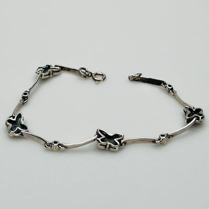 Overhead view of butterfly bracelet laid flat showing clasp and detail