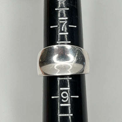 Vintage silver sculptural ring with smooth, polished finish on ring sizer