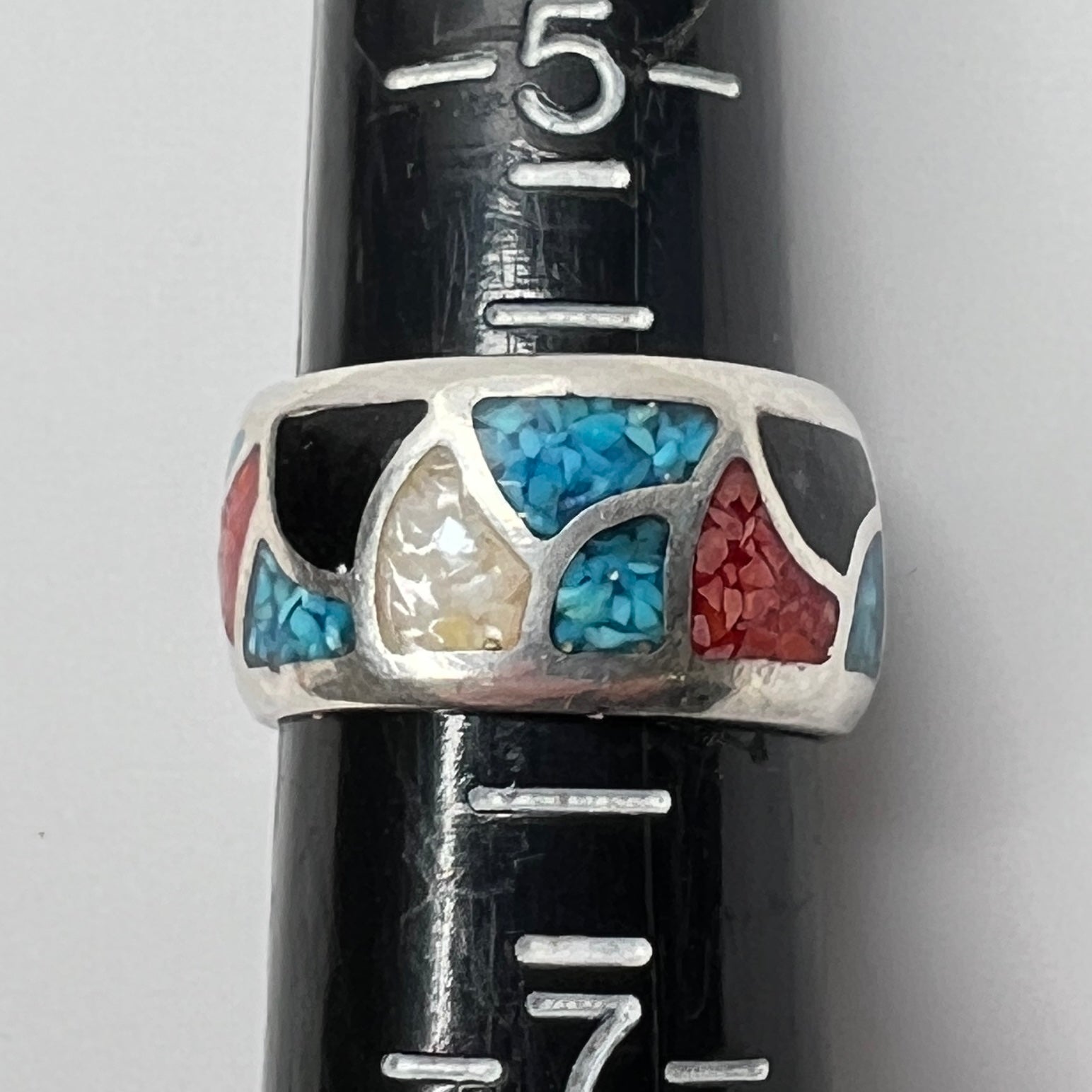 Ring on sizer measuring size 6, 10mm wide with multicolor inlay