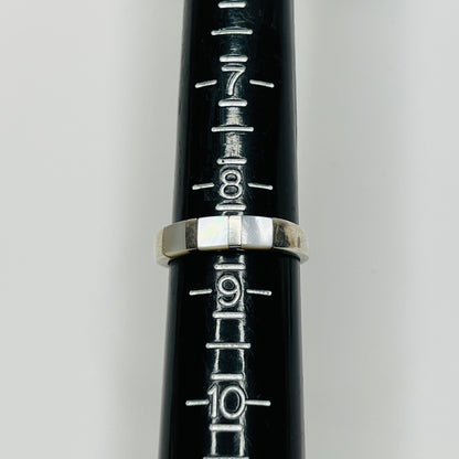 Close-up of iridescent inlay and 925 stamp on inner band
