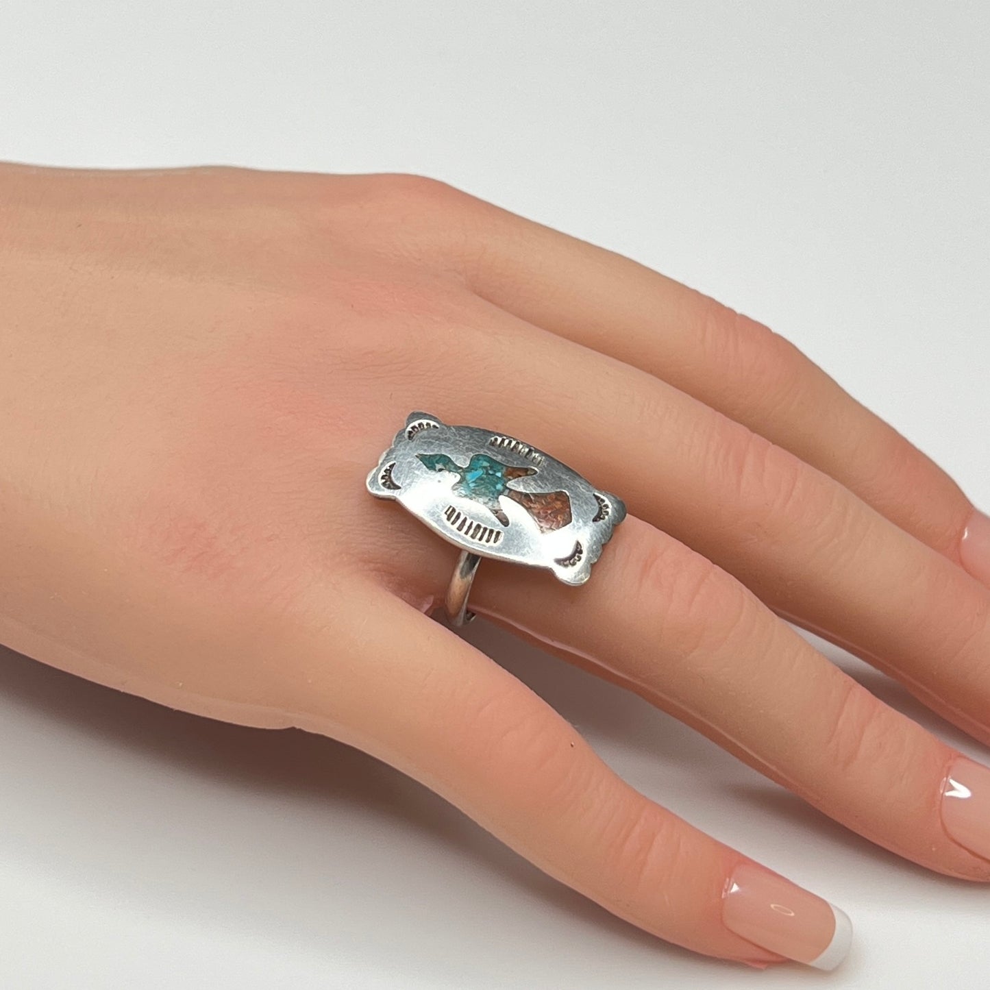 Vintage sterling silver ring with turquoise and coral inlay eagle motif