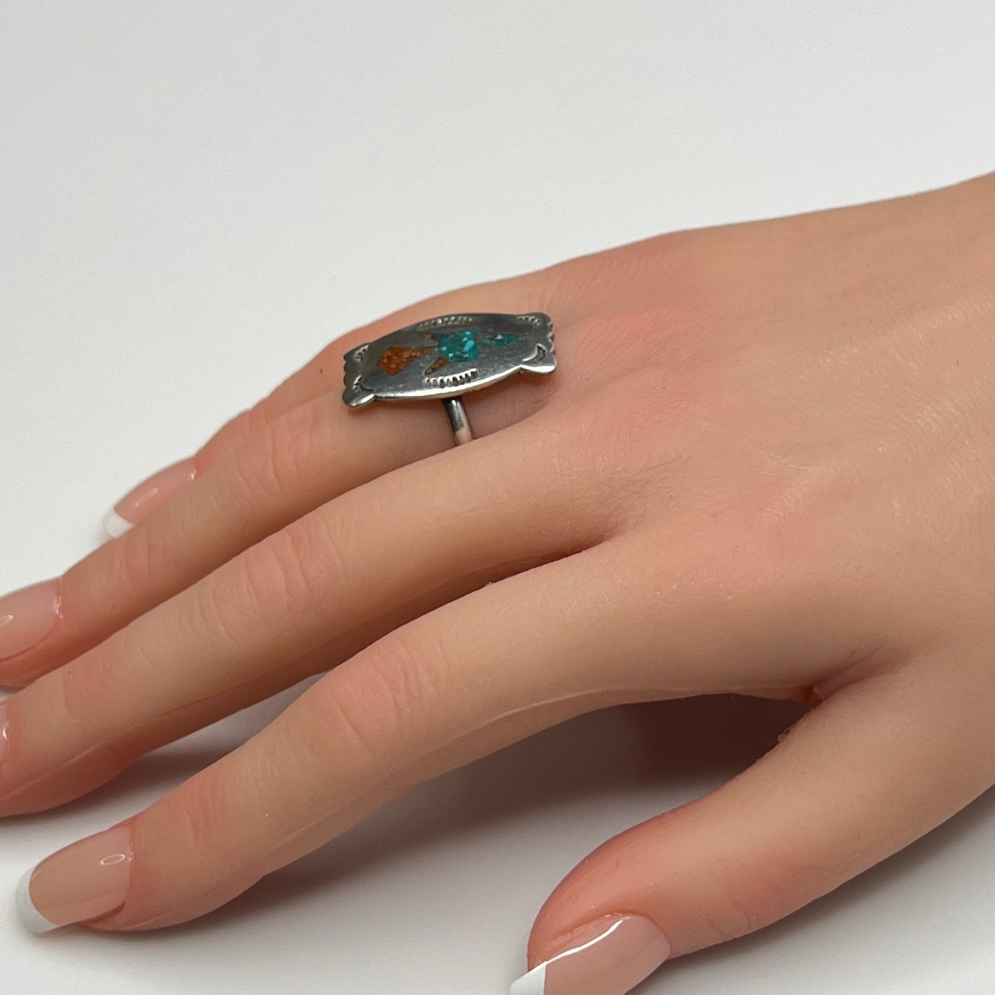 Vintage sterling silver ring with turquoise and coral inlay eagle motif