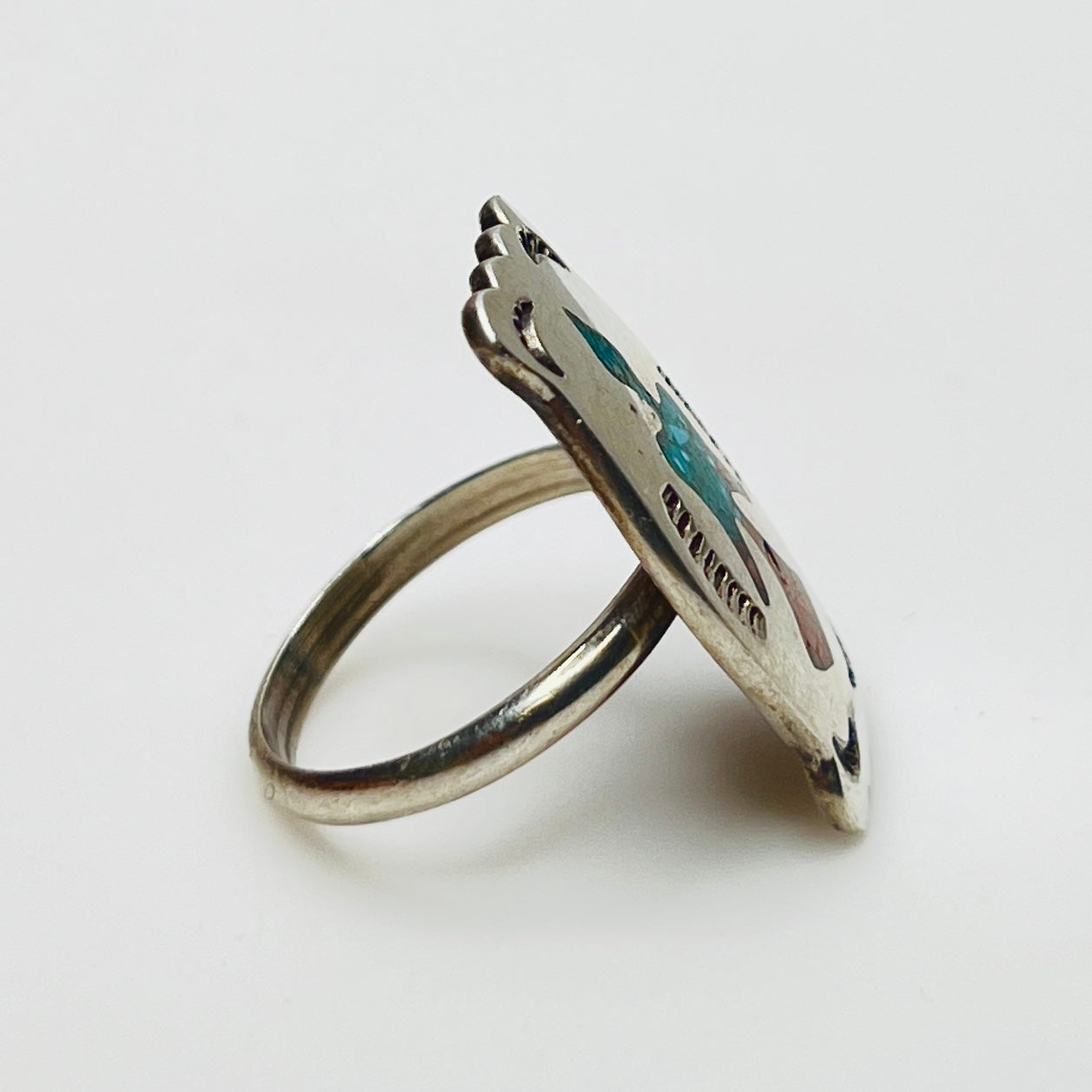 Vintage sterling silver ring with turquoise and coral inlay eagle motif