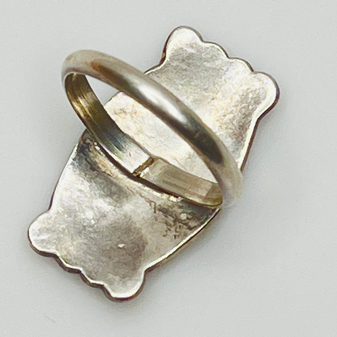 Back view of unmarked vintage sterling silver ring with wide band