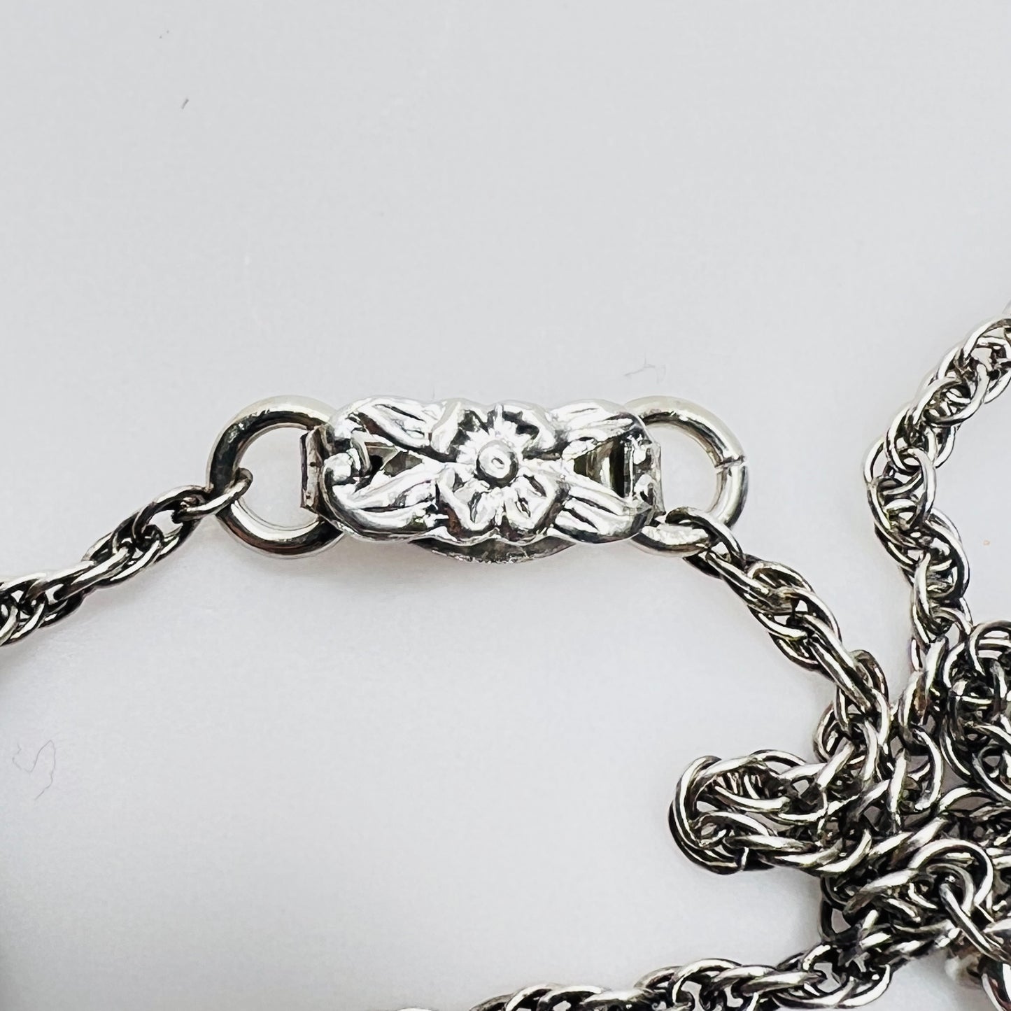 Floral motif clasp on vintage silver-tone chain