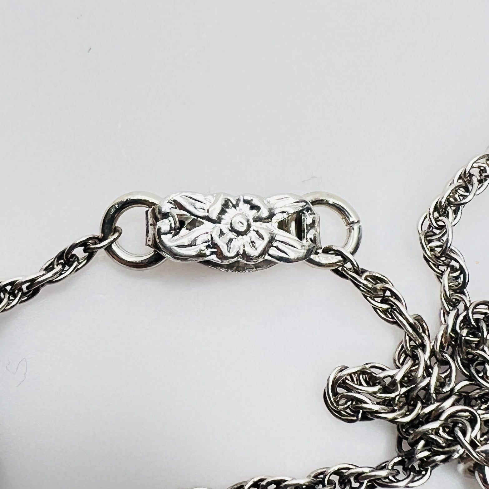 Floral motif clasp on vintage silver-tone chain