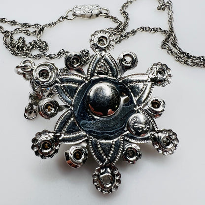 Back of pendant showing Palm Royale maker’s mark and Sterling stamp