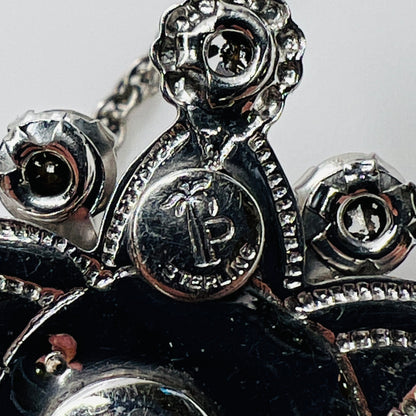 Back of pendant showing Palm Royale maker’s mark and Sterling stamp