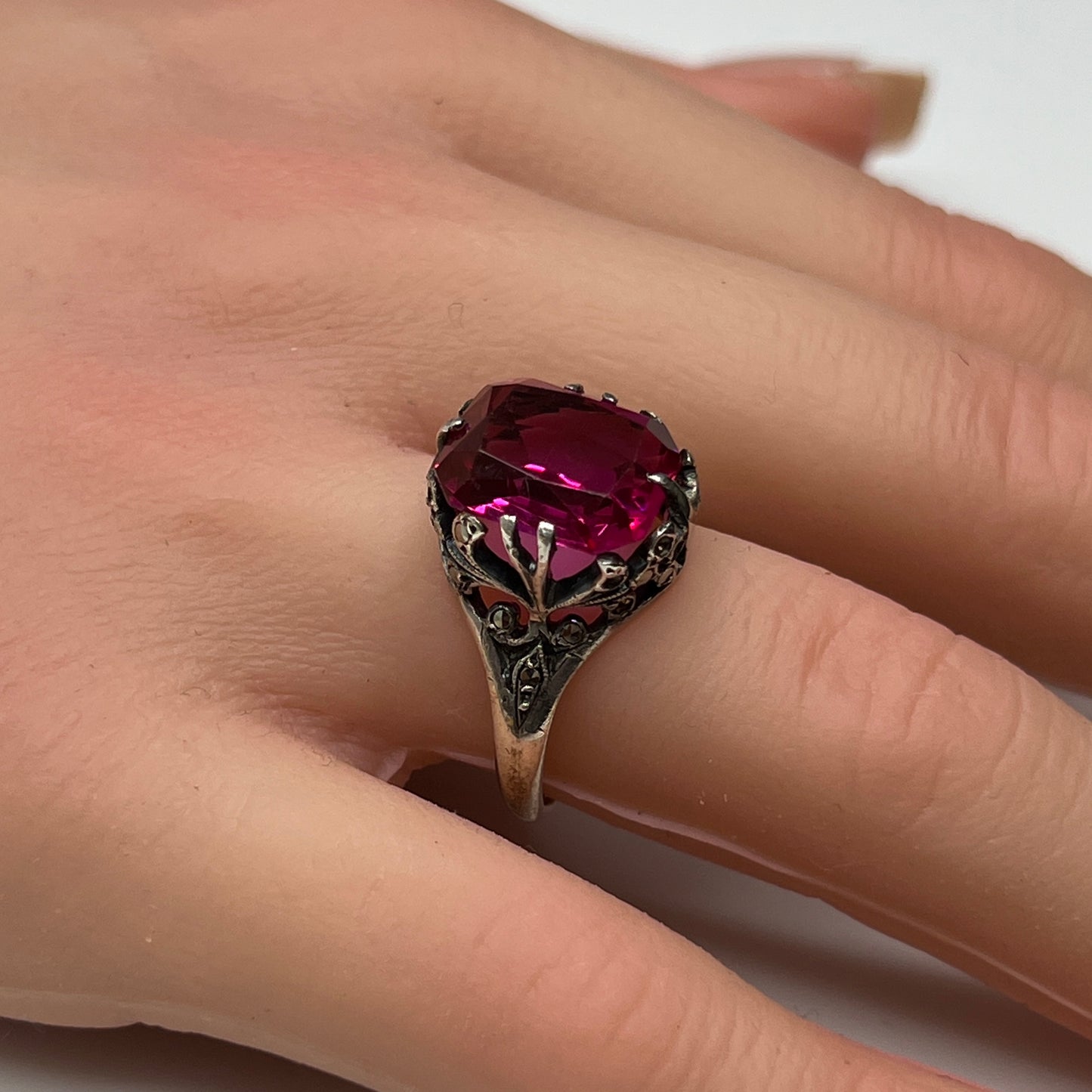 Vintage sterling silver ring with deep pink crystal and marcasite accents