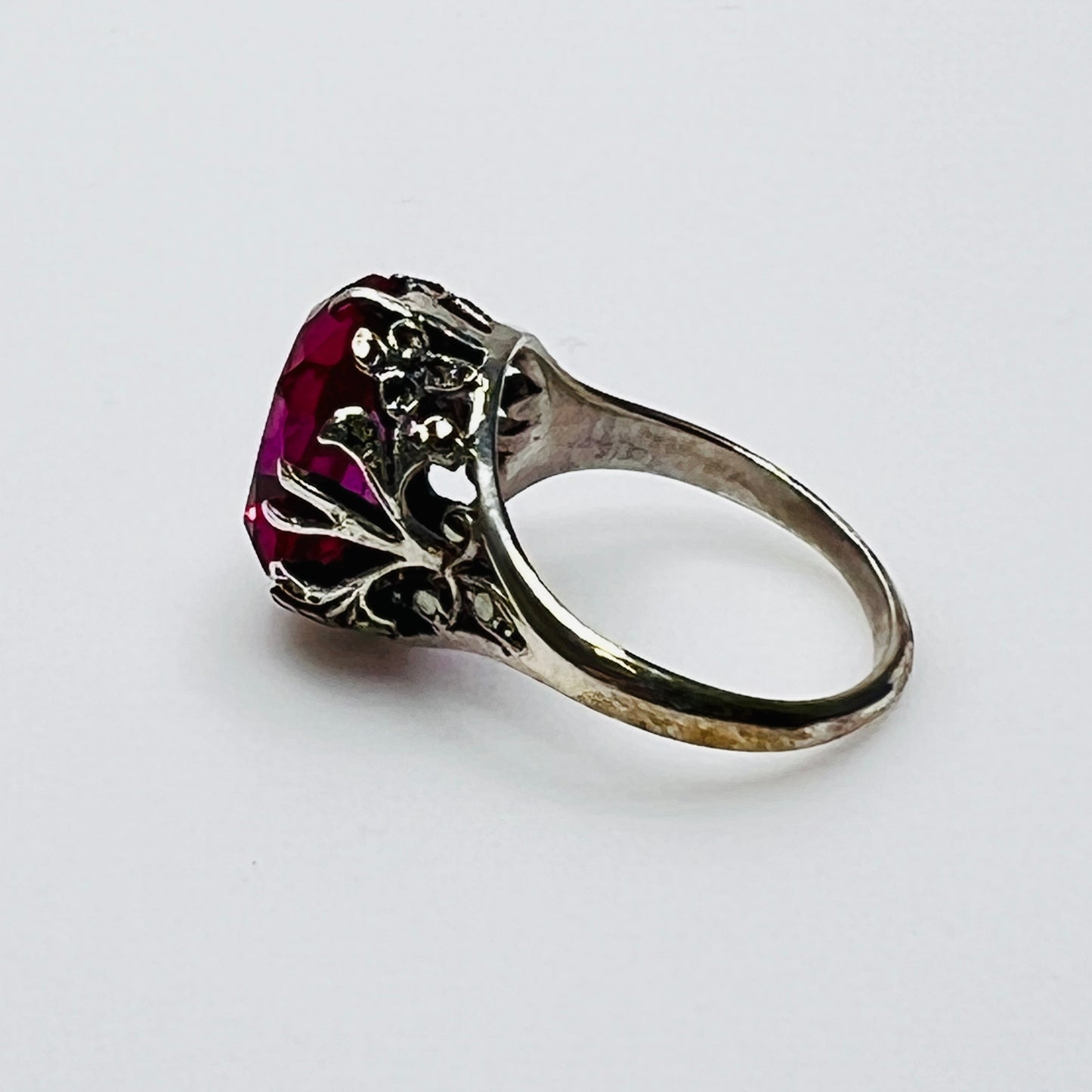 Victorian-style solitaire ring with ornate silver filigree setting