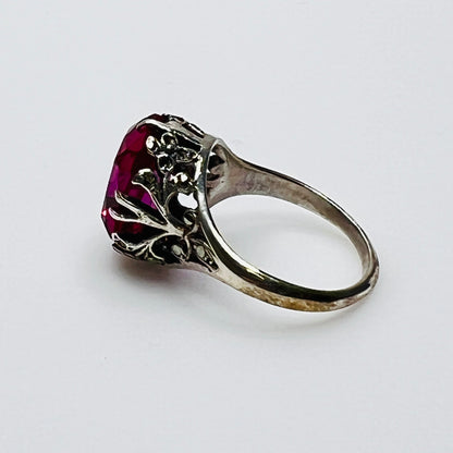 Victorian-style solitaire ring with ornate silver filigree setting