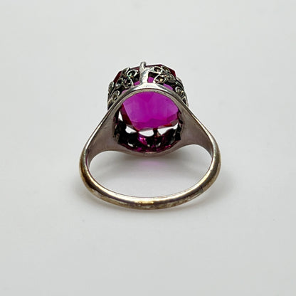 Victorian-style solitaire ring with ornate silver filigree setting