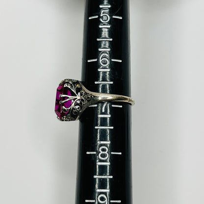 Close-up of pink crystal in sterling ring with antique detailing