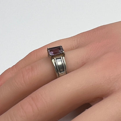Sterling silver ring with rectangular lavender spinel worn on hand