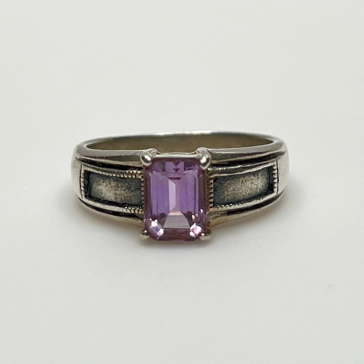 Close-up of vintage Art Deco style silver ring with pale purple spinel