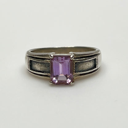 Close-up of vintage Art Deco style silver ring with pale purple spinel