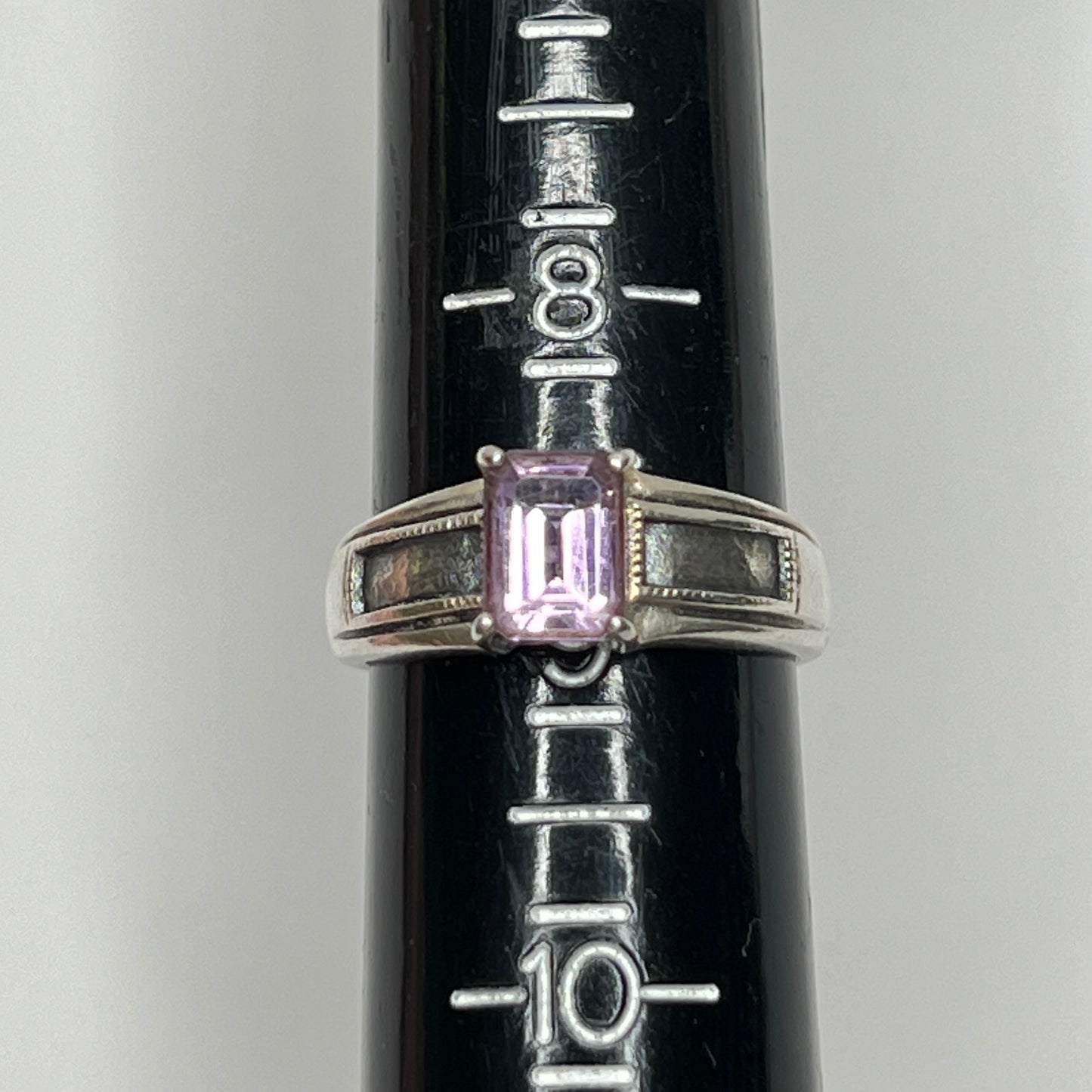 Close-up of vintage Art Deco style silver ring with pale purple spinel