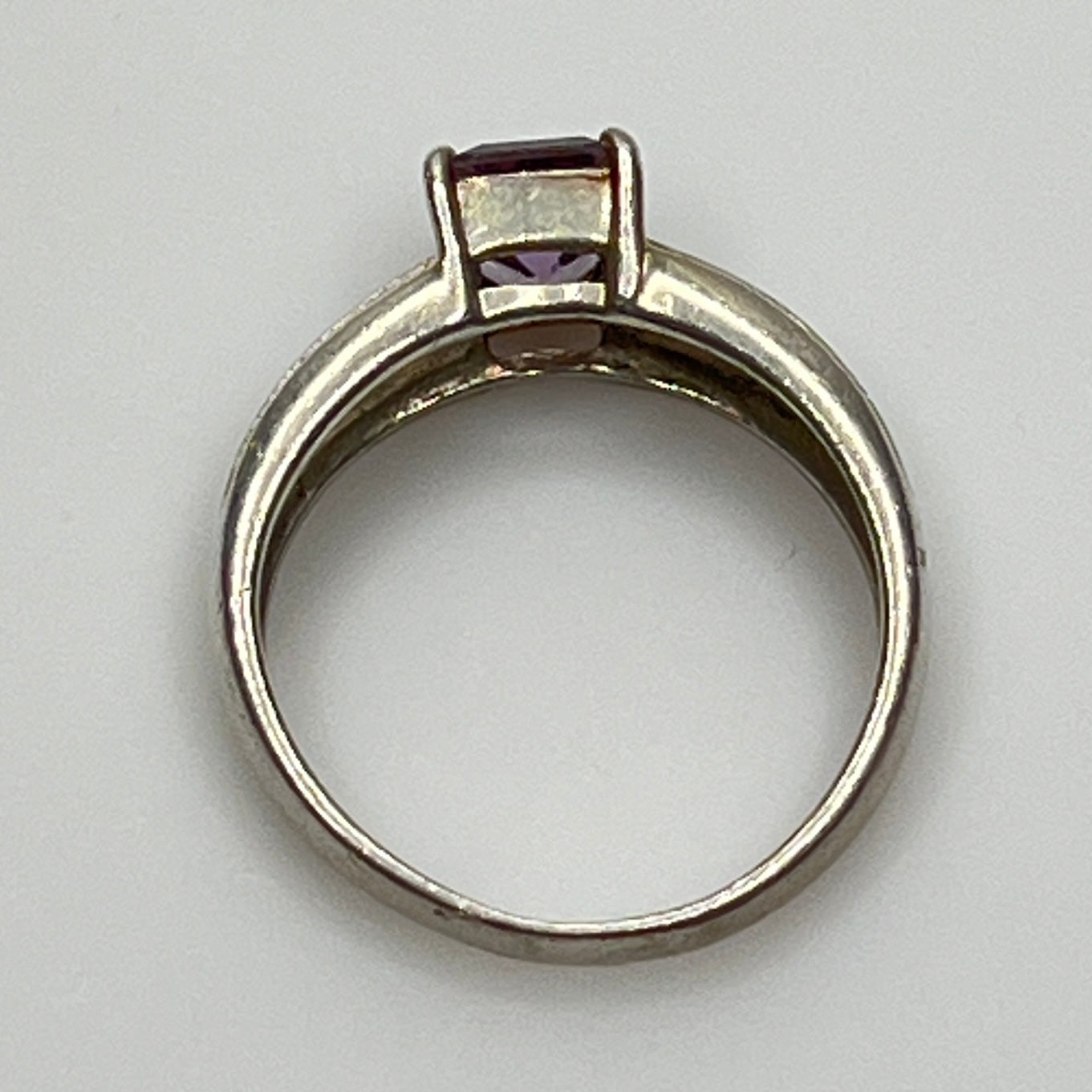 Close-up of vintage Art Deco style silver ring with pale purple spinel