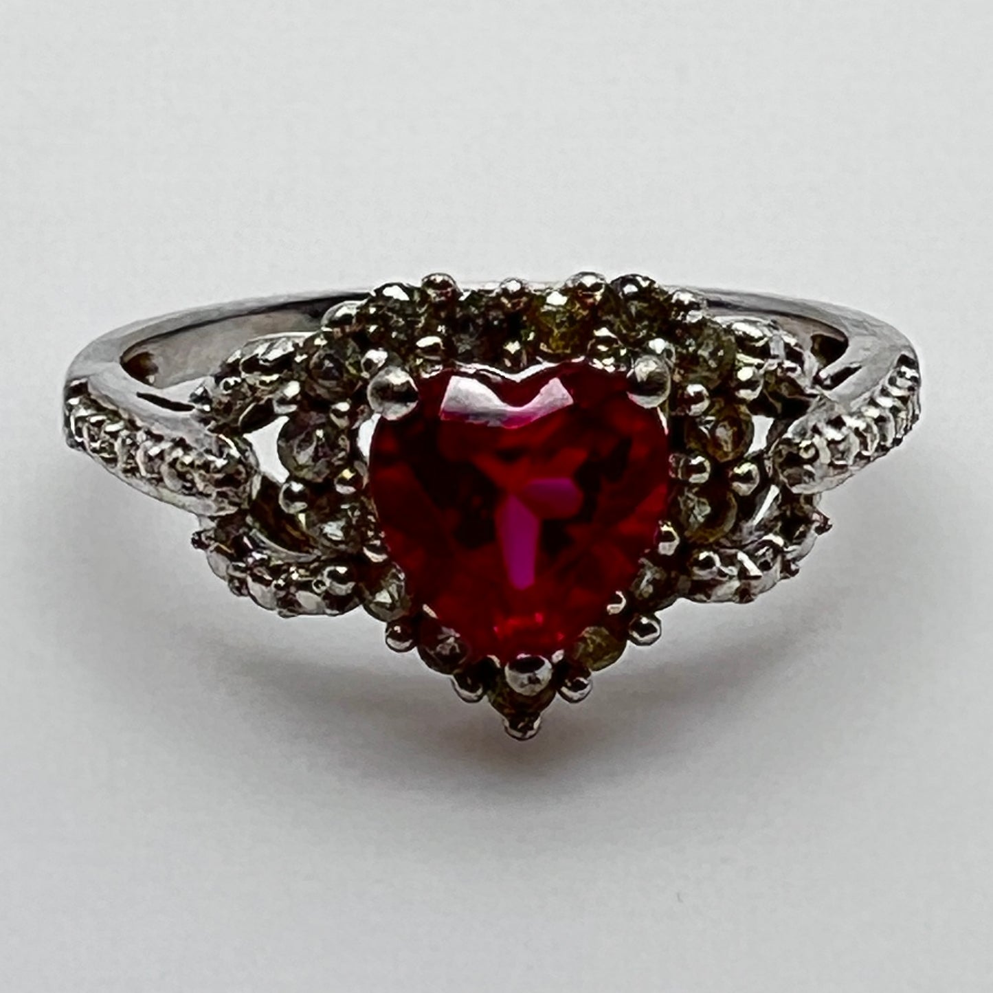 Romantic sterling heart-shaped ring with clear stone accents