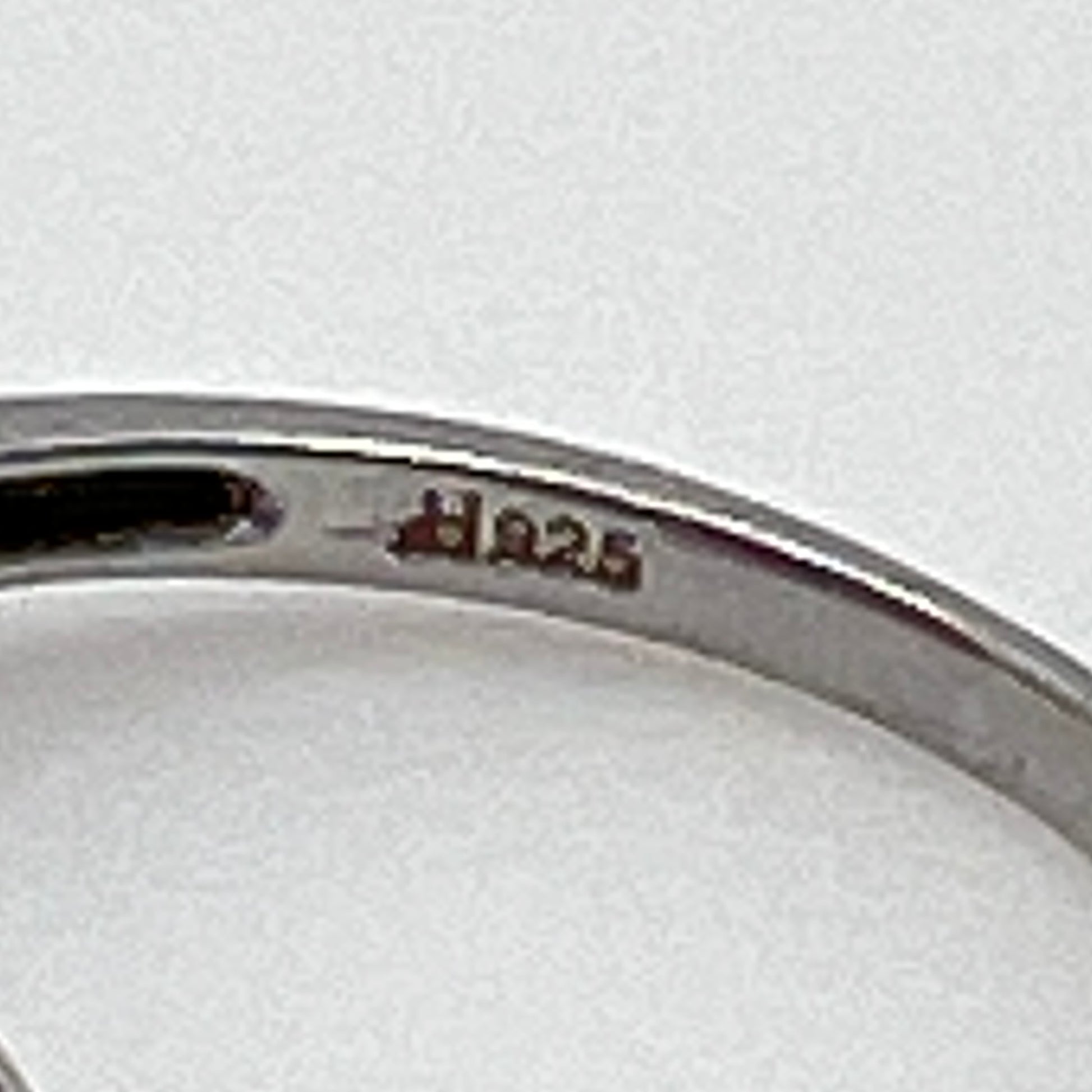 Sterling silver ring with ruby heart center and diamond halo