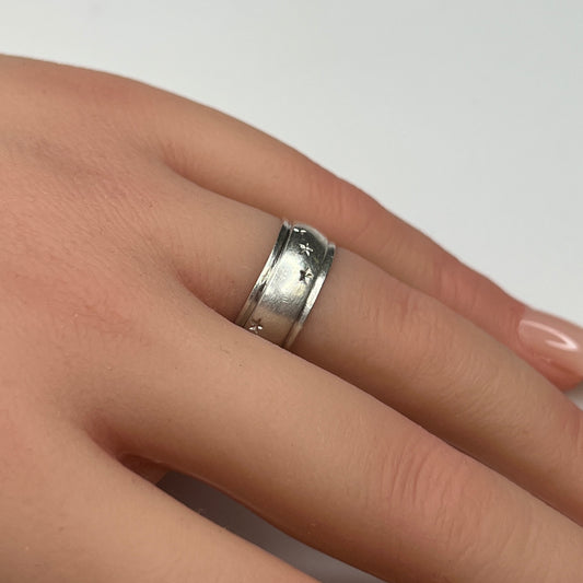 Vintage silver star band ring worn on hand