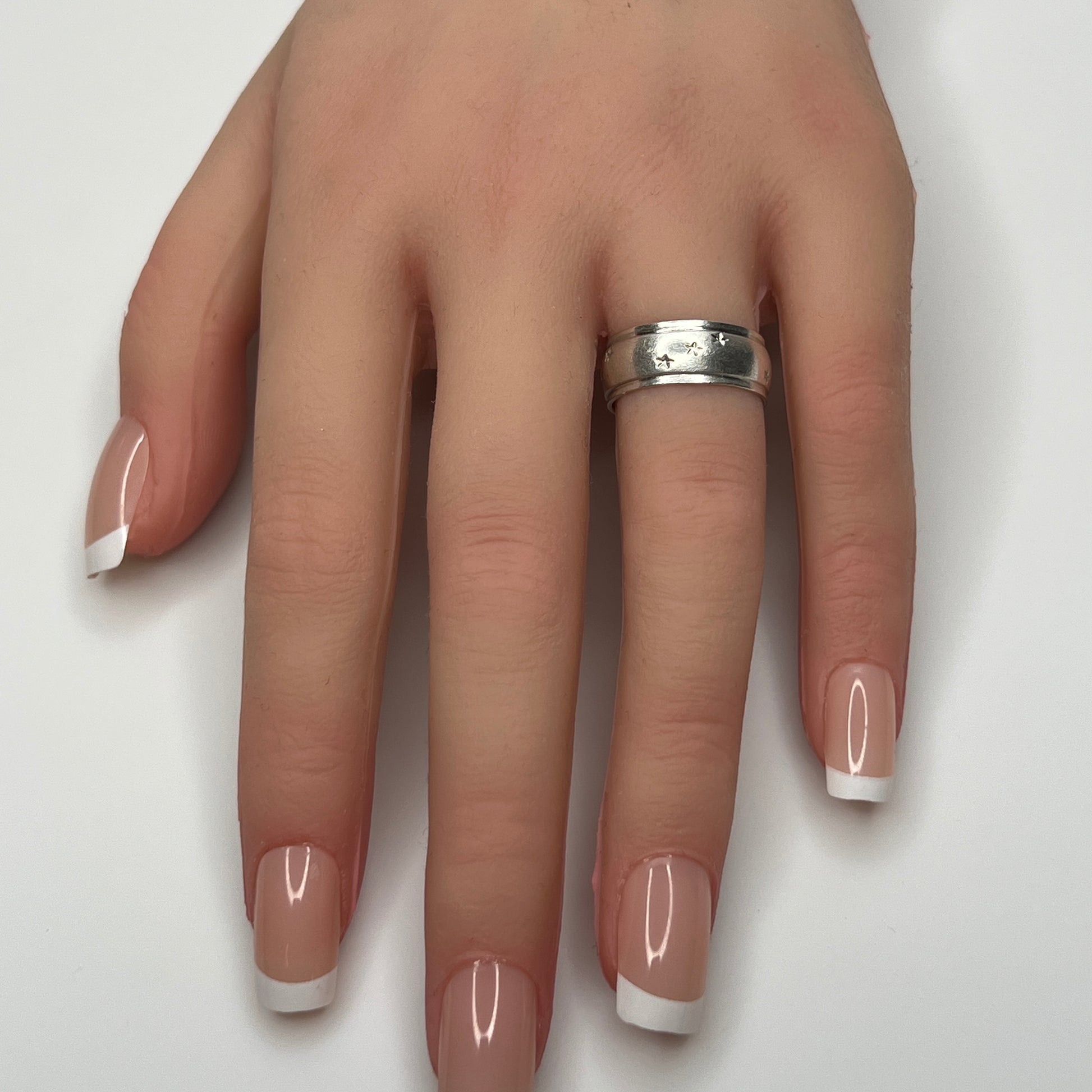 Vintage silver star band ring worn on hand