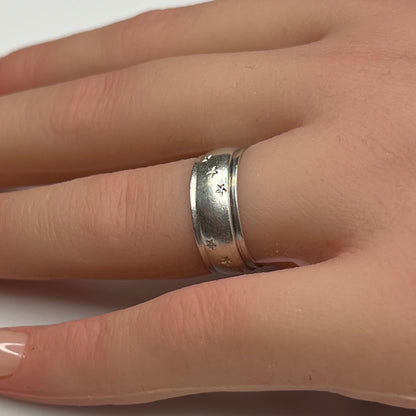 Vintage silver star band ring worn on hand