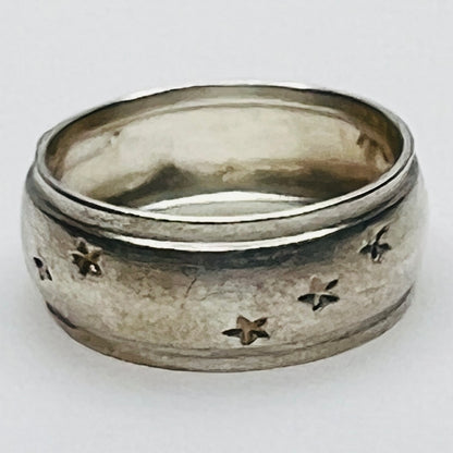 Close-up of engraved sterling ring with star pattern