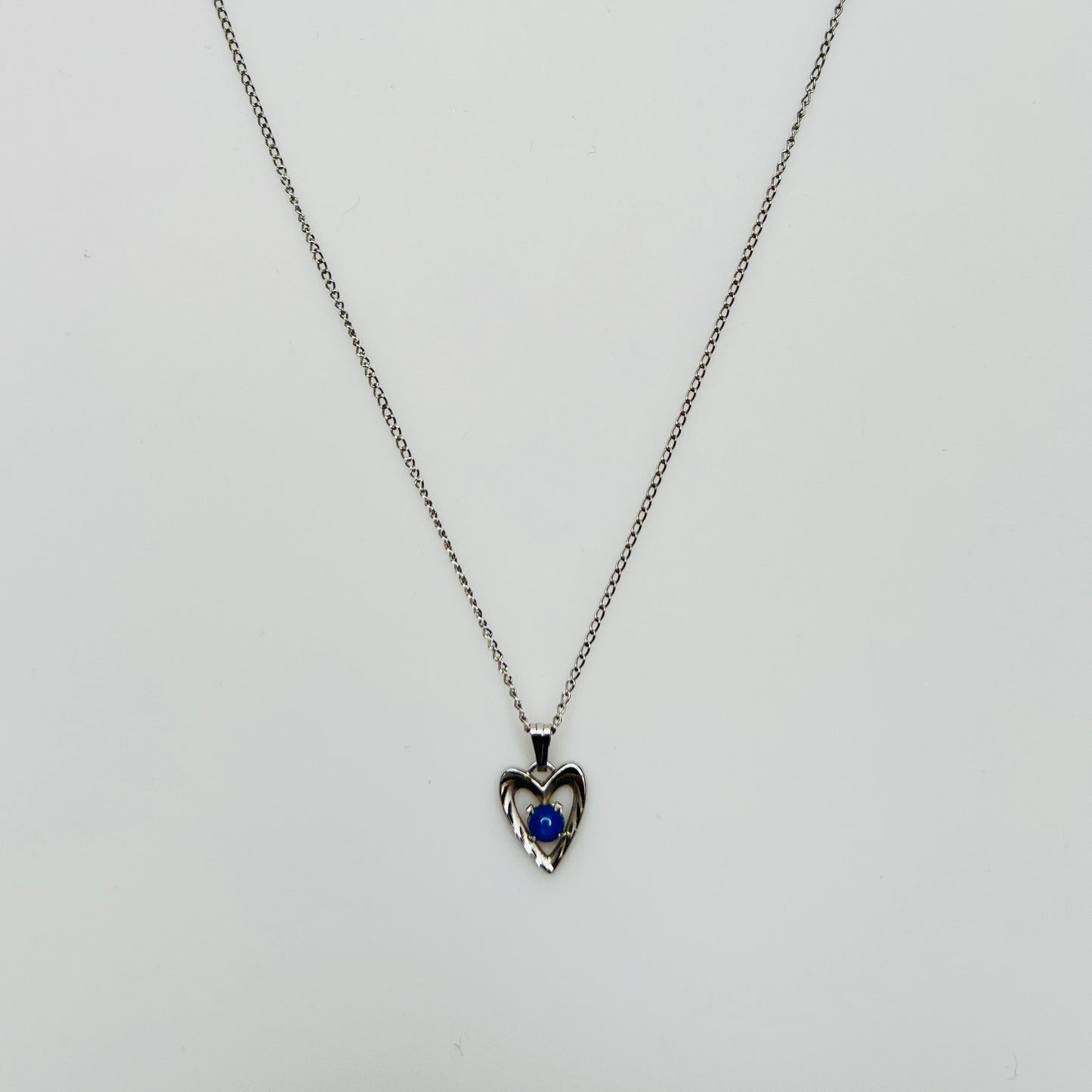 Delicate silver chain with sapphire heart pendant and spring ring clasp