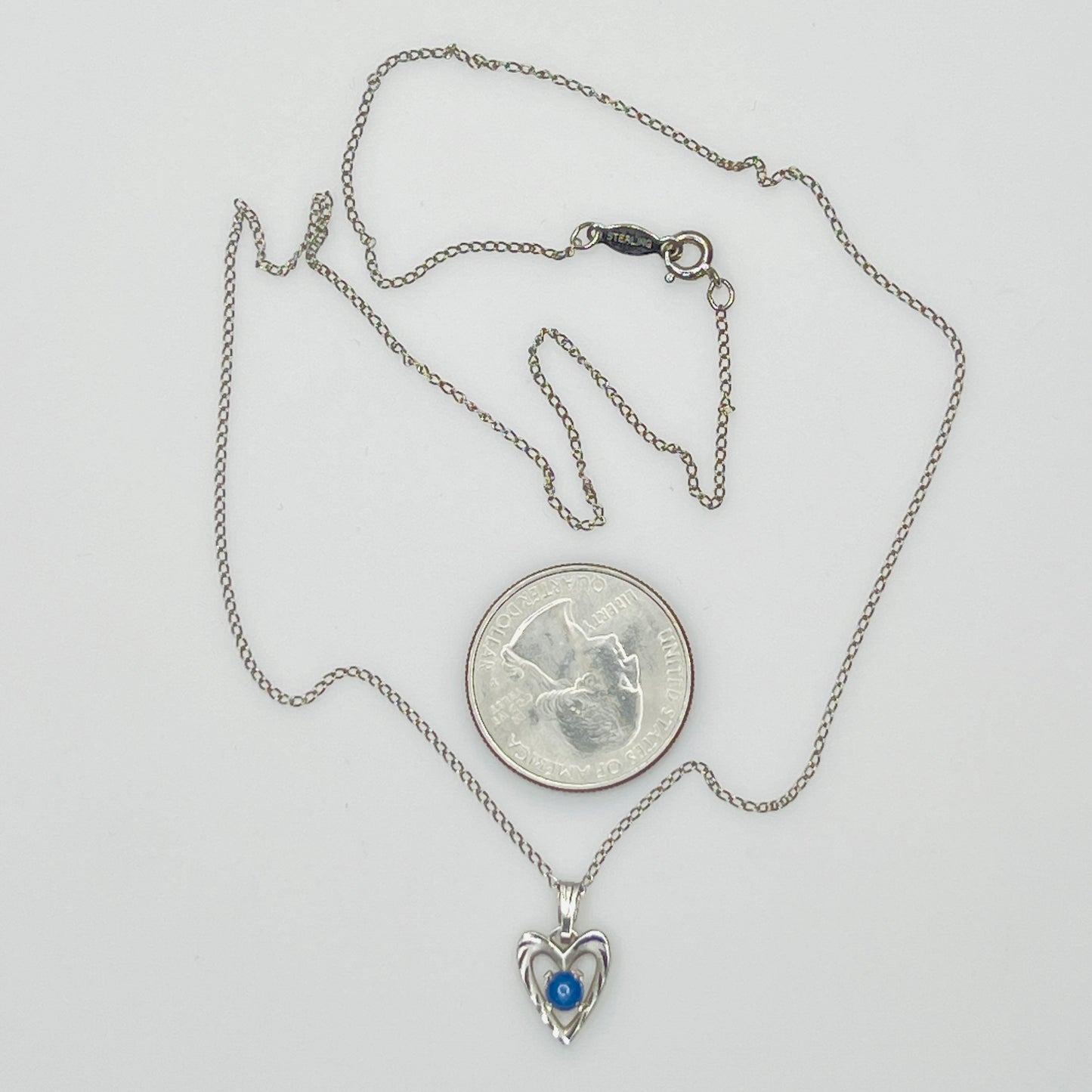 Delicate silver chain with sapphire heart pendant and spring ring clasp