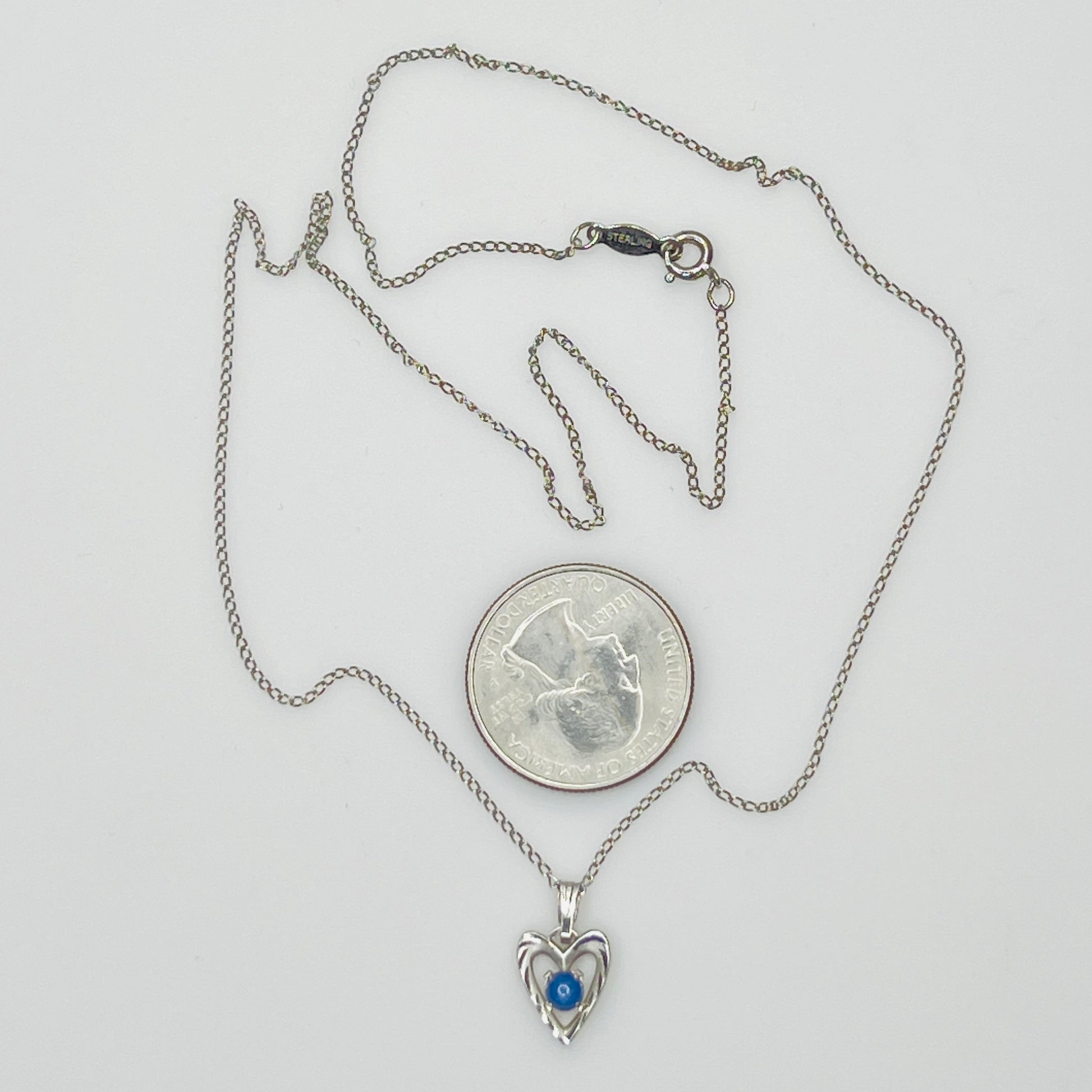 Delicate silver chain with sapphire heart pendant and spring ring clasp