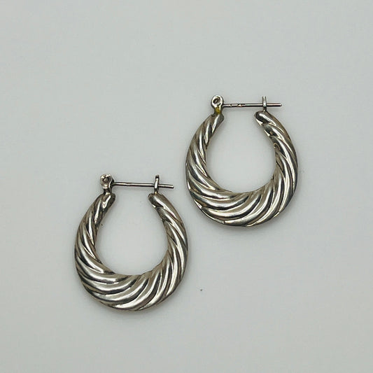 Pair of vintage sterling silver hoop earrings with swirl design