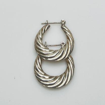 Pair of vintage sterling silver hoop earrings with swirl design