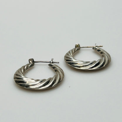 Pair of vintage sterling silver hoop earrings with swirl design