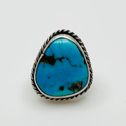 Close-up of 1970s artisan turquoise ring with twisted bezel