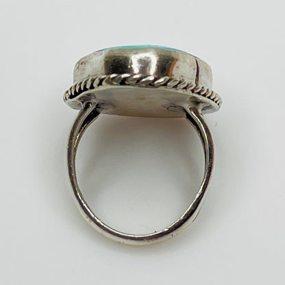 Close-up of 1970s artisan turquoise ring with twisted bezel