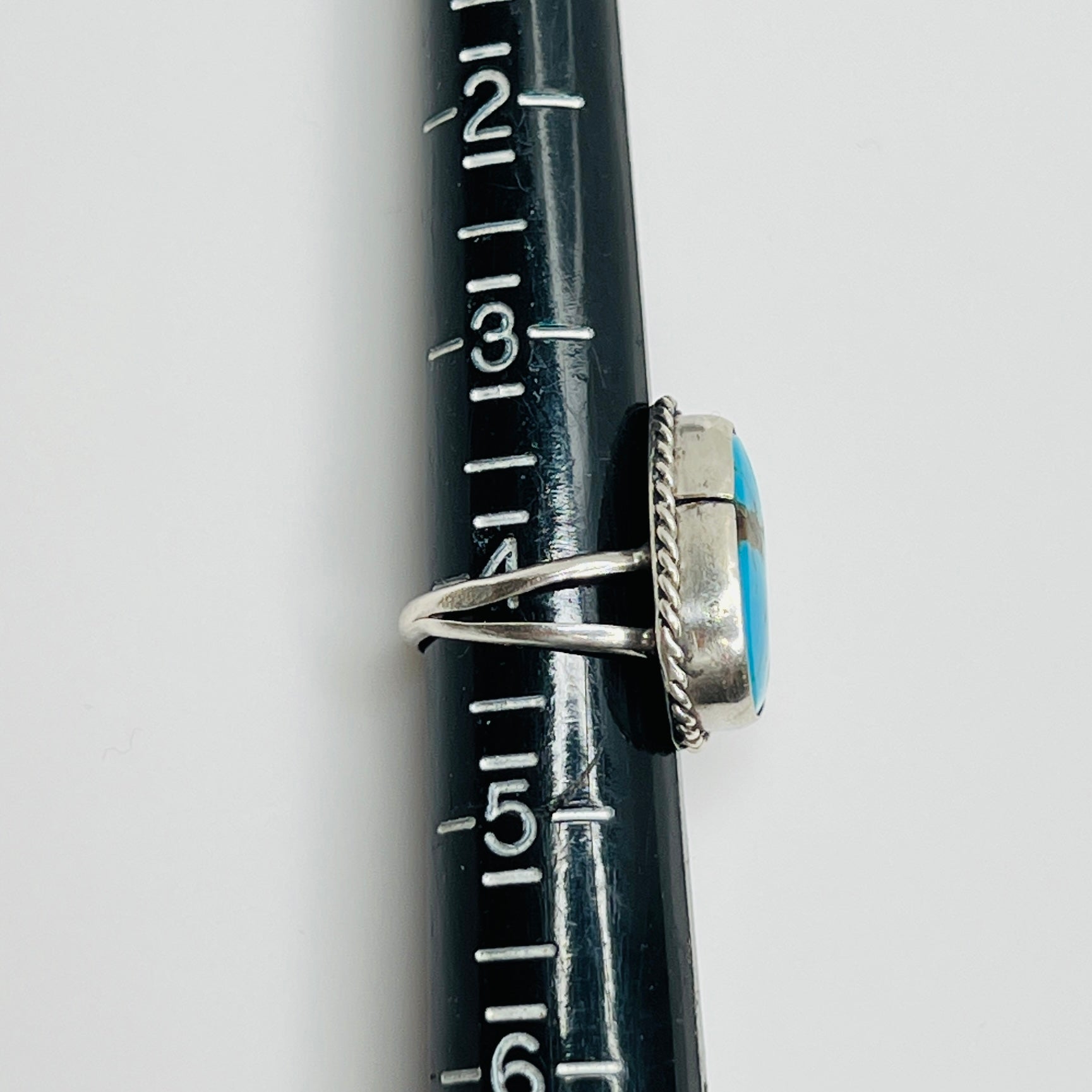 Ring shown on sizer, marked as size 4