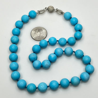 Close-up of turquoise beads with sterling magnetic clasp, laid flat